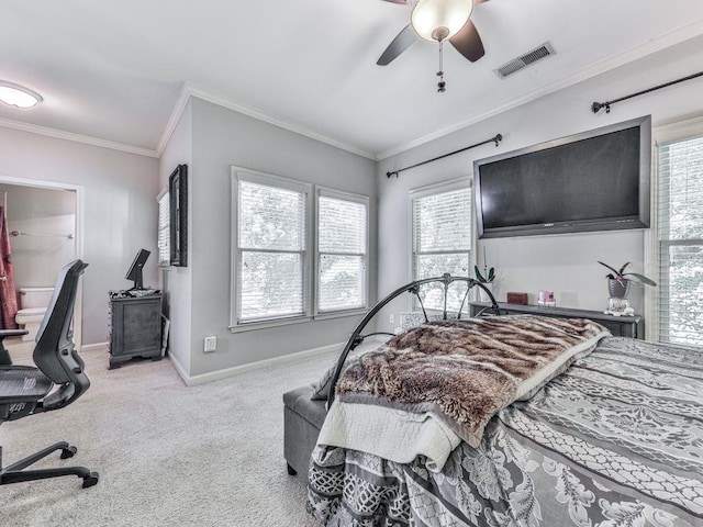 carpeted bedroom with multiple windows, baseboards, crown molding, and ceiling fan