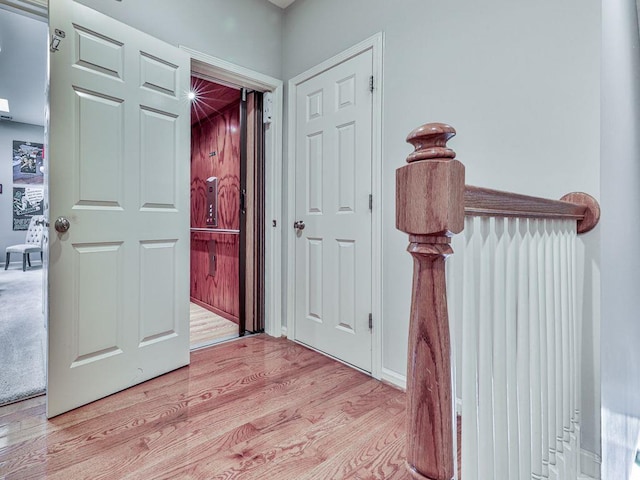 hallway featuring light wood-style flooring