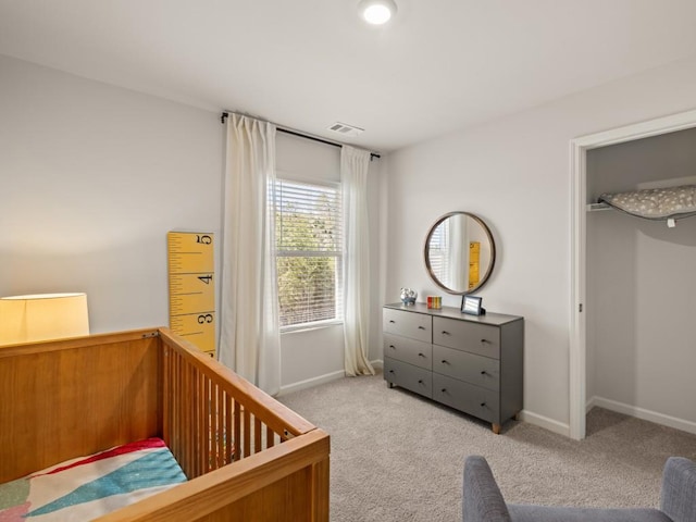 bedroom with carpet flooring and baseboards