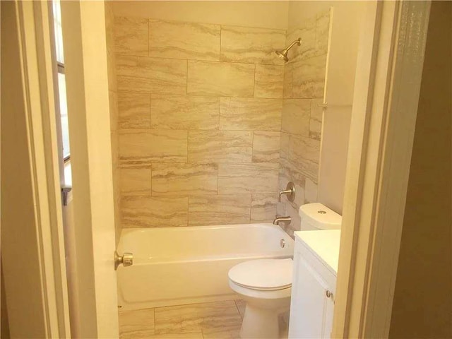 full bath with toilet,  shower combination, vanity, and marble finish floor