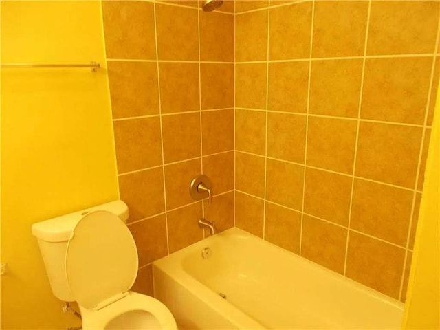 bathroom featuring toilet and shower / bathtub combination