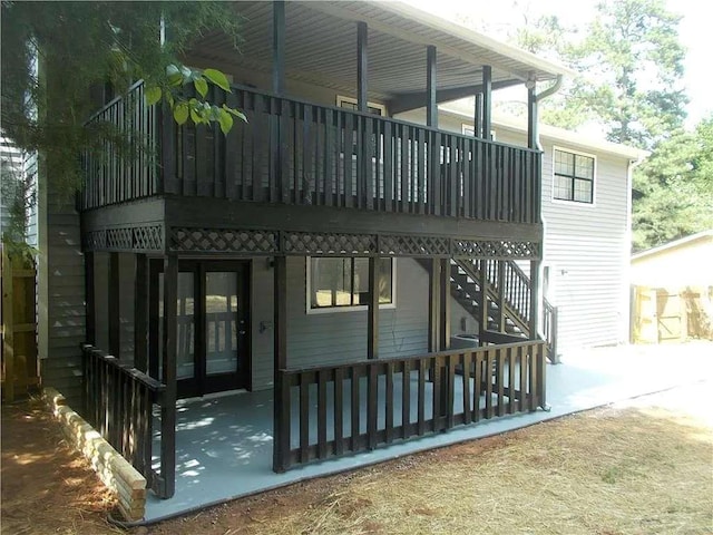 exterior space with a patio area and stairs