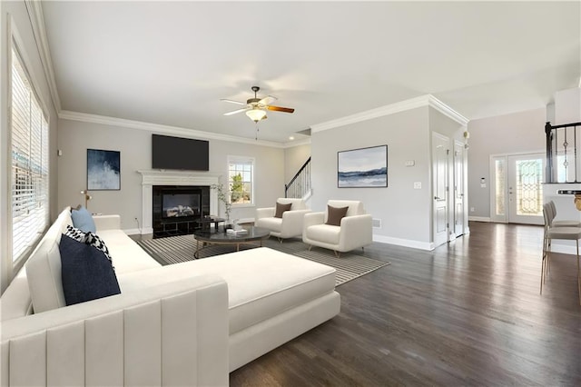 living room featuring crown molding, ceiling fan, and dark hardwood / wood-style floors