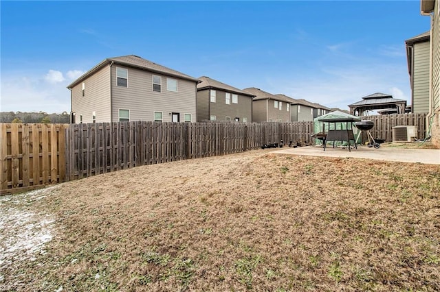 view of yard featuring a gazebo, a patio area, and central AC