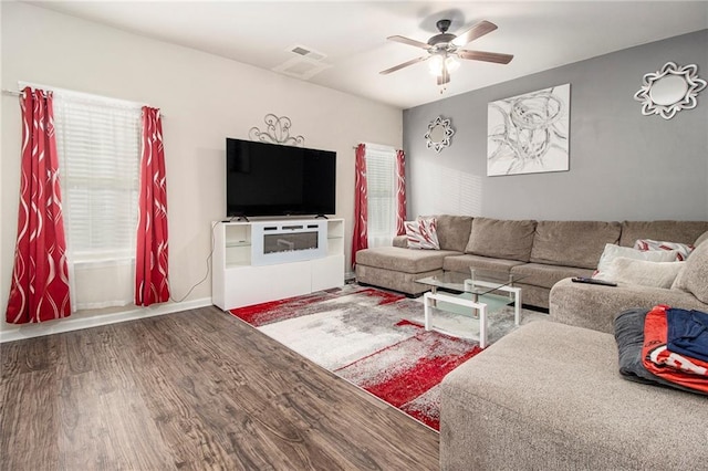 living room with hardwood / wood-style floors and ceiling fan