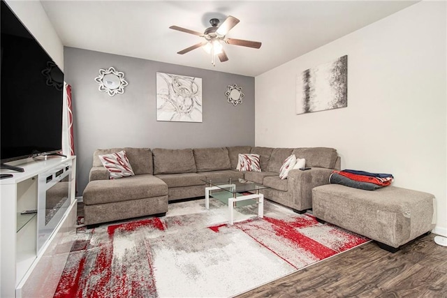 living room with hardwood / wood-style floors and ceiling fan