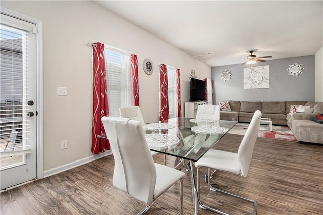 dining area featuring dark hardwood / wood-style floors and ceiling fan