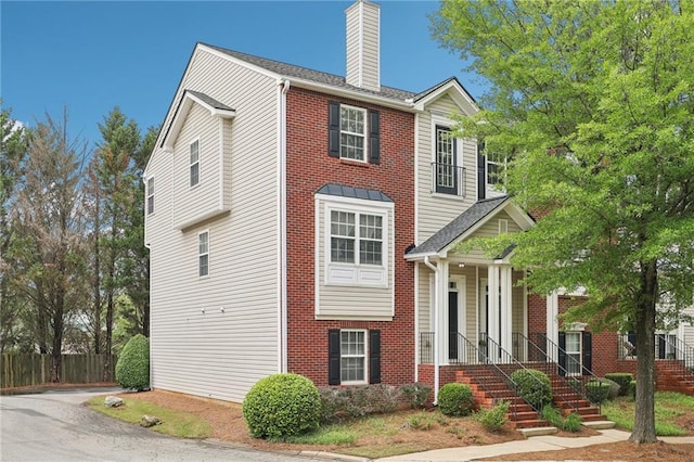 106 Weatherstone Square Dr, Woodstock, GA 30188 - view of front facade with a chimney and brick siding