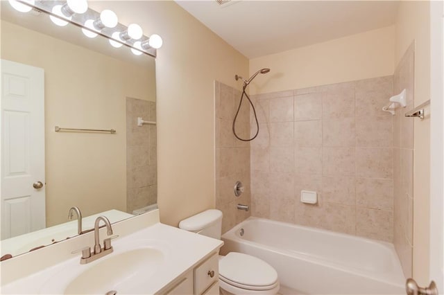 bathroom with tub / shower combination, toilet, and vanity