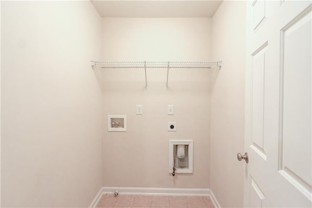 washroom with hookup for a gas dryer, baseboards, hookup for an electric dryer, hookup for a washing machine, and laundry area