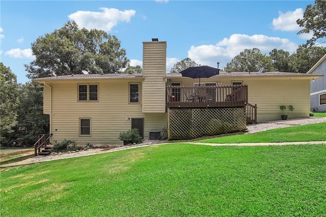 back of house featuring a wooden deck, central air condition unit, and a lawn