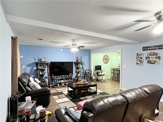 living room with ceiling fan and light wood-type flooring