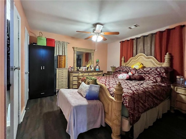 bedroom featuring ceiling fan and dark hardwood / wood-style floors