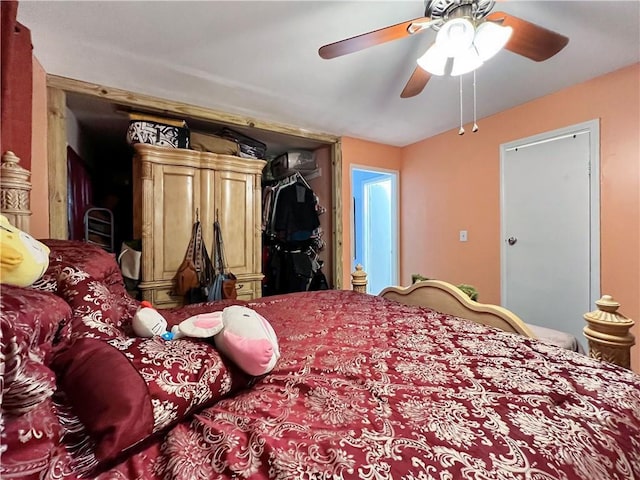 bedroom with ceiling fan and a closet