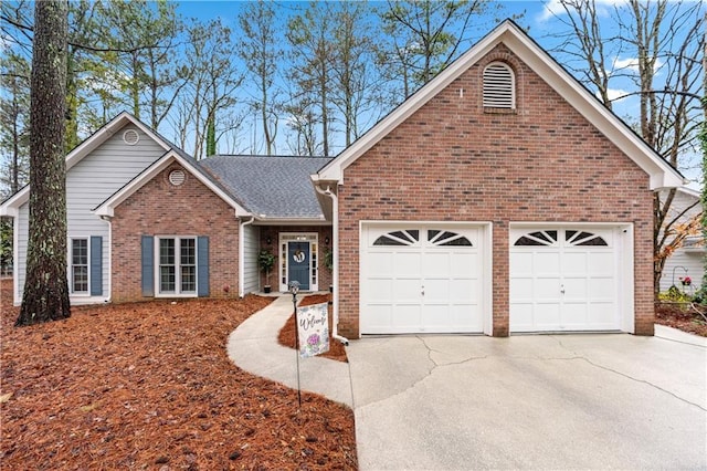 view of front facade featuring concrete driveway, a garage, brick siding, and a shingled roof