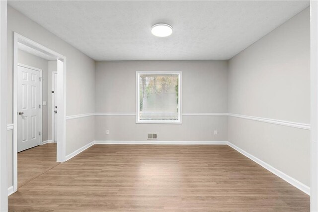 unfurnished room featuring light wood-type flooring