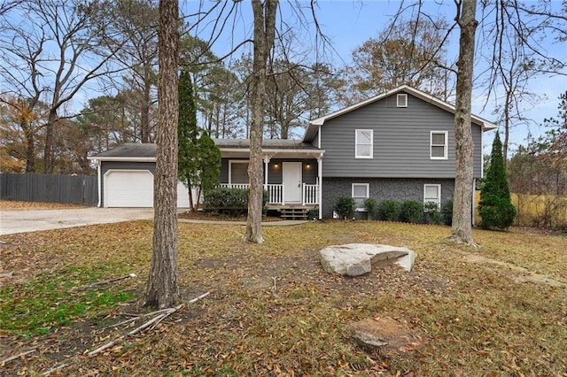 view of front facade with covered porch and a garage