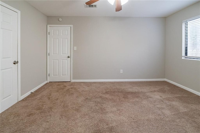 carpeted empty room with ceiling fan