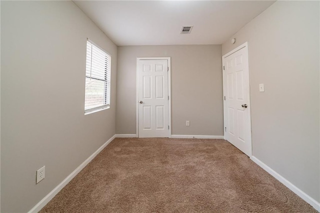 spare room with carpet floors