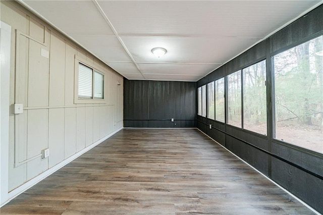 unfurnished sunroom featuring a wealth of natural light