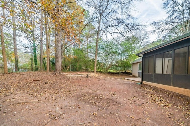 view of yard with a sunroom