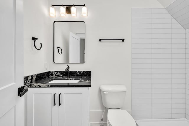 2335 Flat Stone Dr, Cumming, GA 30041 - bathroom with toilet, tiled shower, and vanity