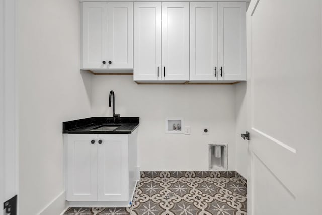 2335 Flat Stone Dr, Cumming, GA 30041 - clothes washing area featuring cabinet space, electric dryer hookup, hookup for a washing machine, and a sink