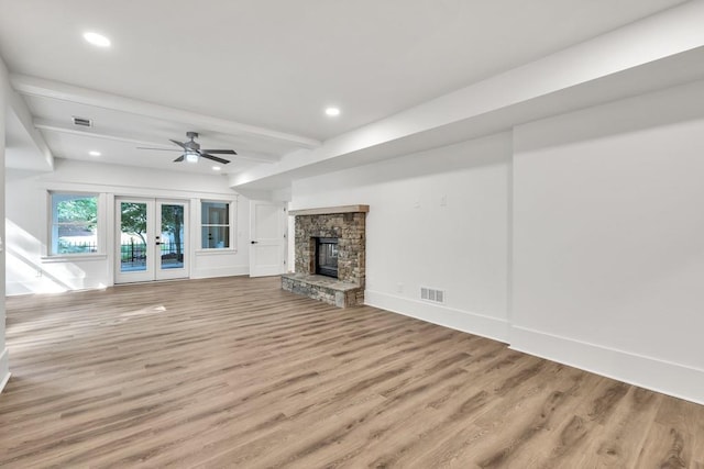 2335 Flat Stone Dr, Cumming, GA 30041 - unfurnished living room featuring french doors, light wood finished floors, ceiling fan, visible vents, and beam ceiling