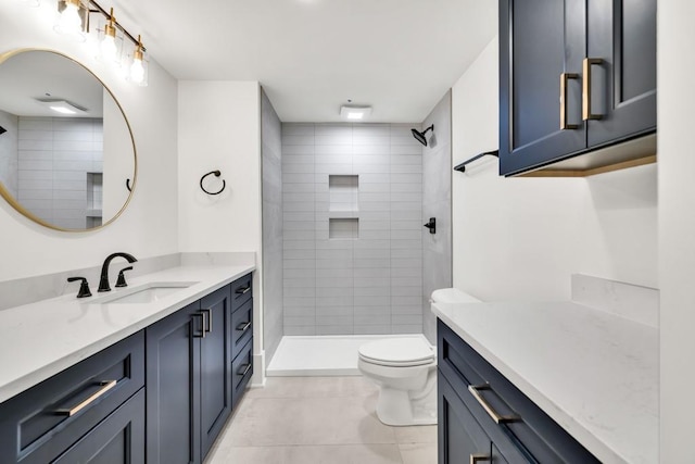 2335 Flat Stone Dr, Cumming, GA 30041 - full bath featuring toilet, tile patterned flooring, vanity, and a tile shower