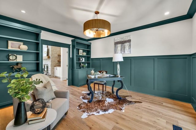 2335 Flat Stone Dr, Cumming, GA 30041 - home office with a decorative wall, wainscoting, visible vents, and built in features
