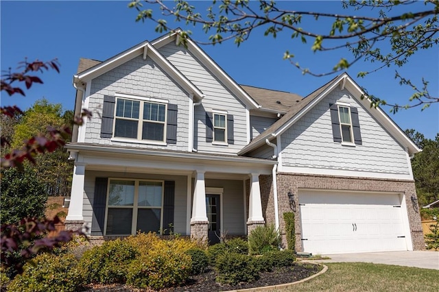 2034 W Hampton Dr, Canton, GA 30115 - craftsman-style home with brick siding, driveway, a garage, and a porch