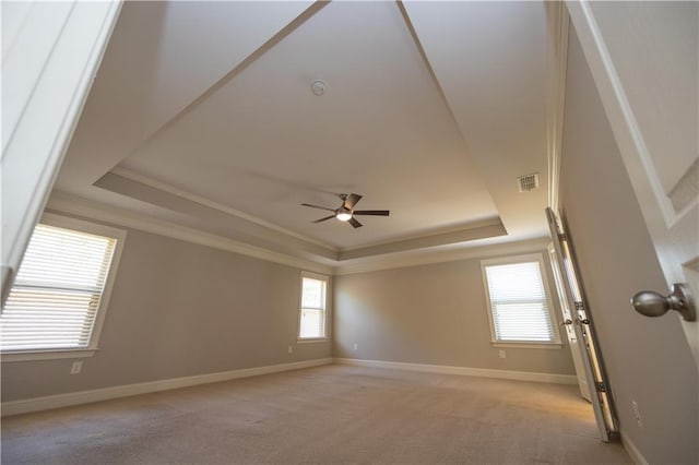 2034 W Hampton Dr, Canton, GA 30115 - spare room with ornamental molding, a tray ceiling, visible vents, and light carpet