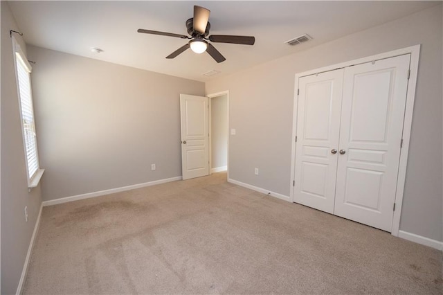 2034 W Hampton Dr, Canton, GA 30115 - unfurnished bedroom featuring light carpet, visible vents, and baseboards