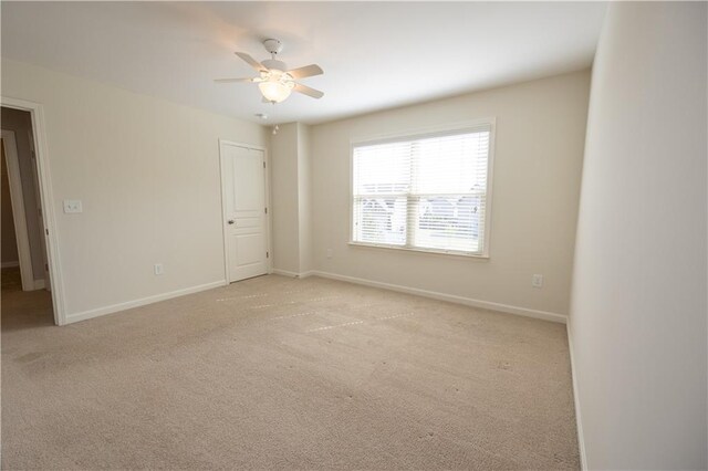 2034 W Hampton Dr, Canton, GA 30115 - empty room with ceiling fan, light colored carpet, and baseboards