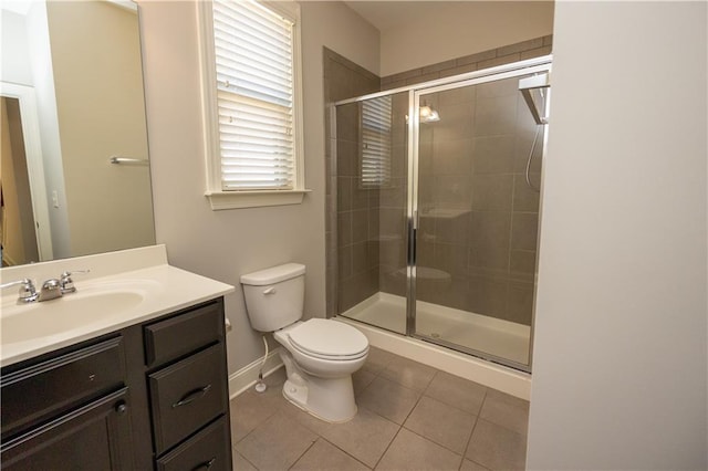 2034 W Hampton Dr, Canton, GA 30115 - bathroom featuring toilet, tile patterned flooring, vanity, and a stall shower