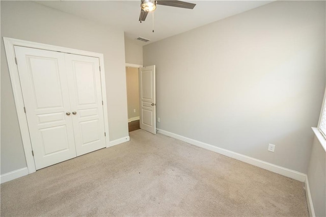 2034 W Hampton Dr, Canton, GA 30115 - unfurnished bedroom with light carpet, a closet, baseboards, and visible vents
