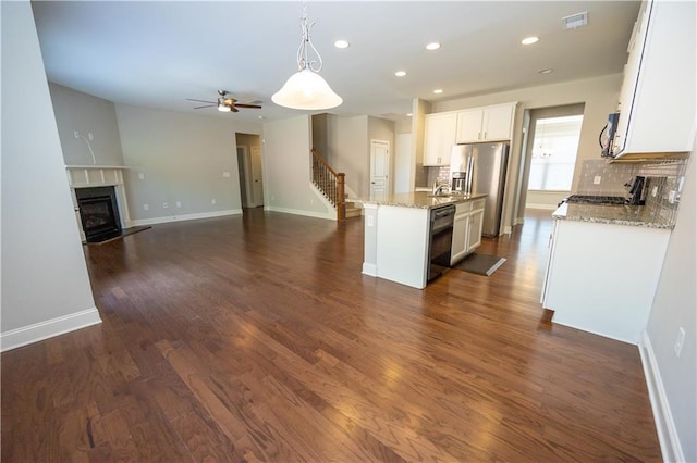 2034 W Hampton Dr, Canton, GA 30115 - kitchen with visible vents, ceiling fan, appliances with stainless steel finishes, recessed lighting, and a premium fireplace