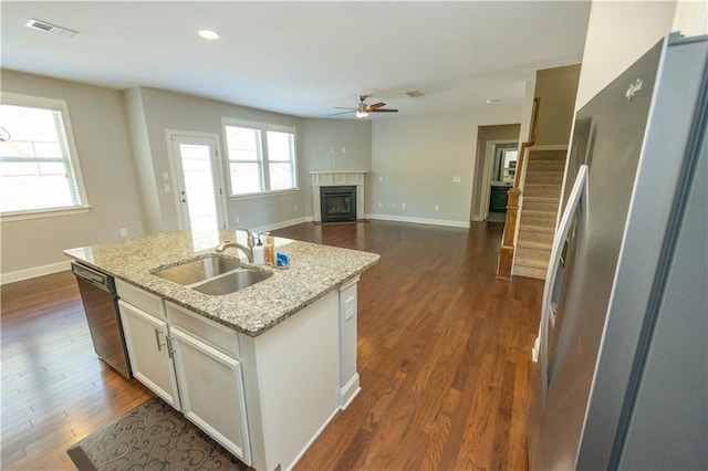 2034 W Hampton Dr, Canton, GA 30115 - kitchen featuring freestanding refrigerator, dishwashing machine, a ceiling fan, visible vents, and a sink