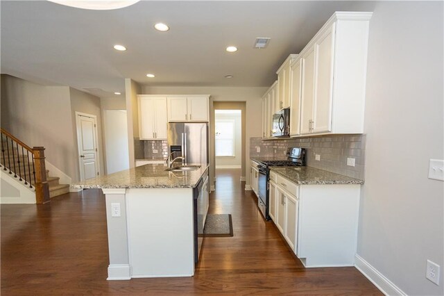 2034 W Hampton Dr, Canton, GA 30115 - kitchen with dark wood-style floors, visible vents, a sink, and appliances with stainless steel finishes