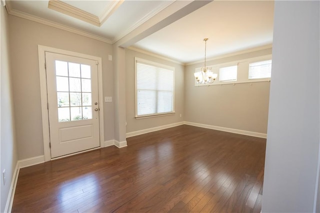 2034 W Hampton Dr, Canton, GA 30115 - doorway with crown molding, an inviting chandelier, baseboards, and dark wood-style floors