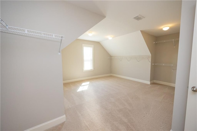 2034 W Hampton Dr, Canton, GA 30115 - additional living space featuring visible vents, baseboards, vaulted ceiling, and carpet floors