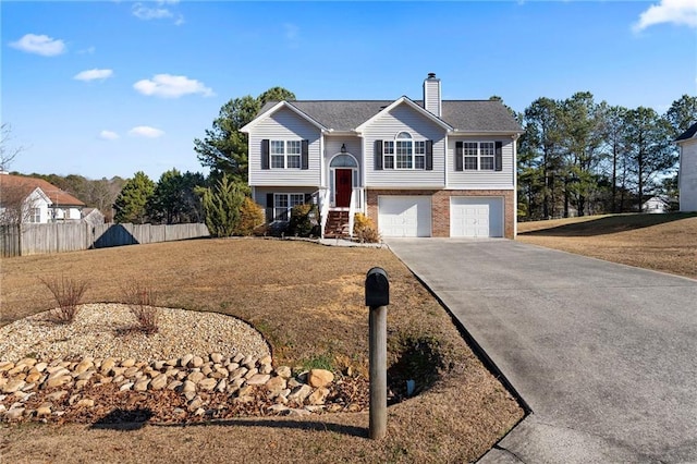 split foyer home featuring a garage