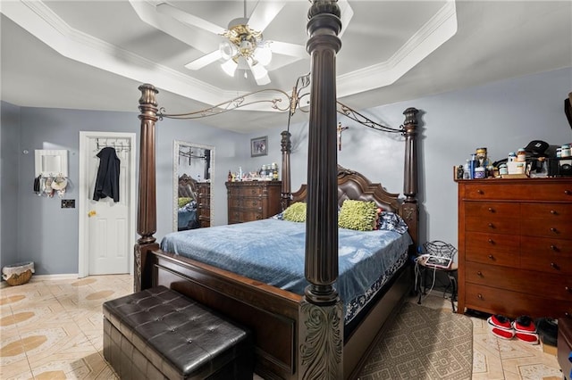 bedroom featuring a raised ceiling, light tile patterned flooring, crown molding, and baseboards