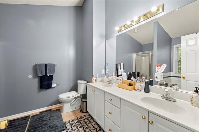 full bathroom with a garden tub, tile patterned flooring, a sink, a shower stall, and double vanity