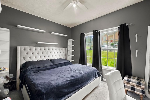 bedroom featuring a ceiling fan, carpet, and baseboards