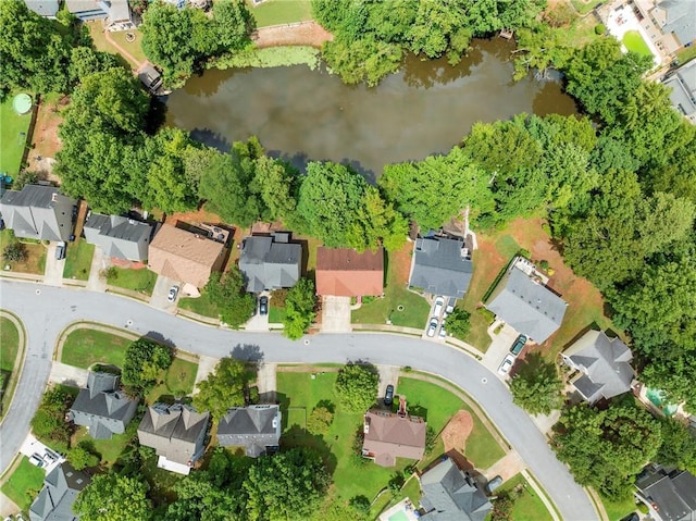 birds eye view of property with a residential view and a water view