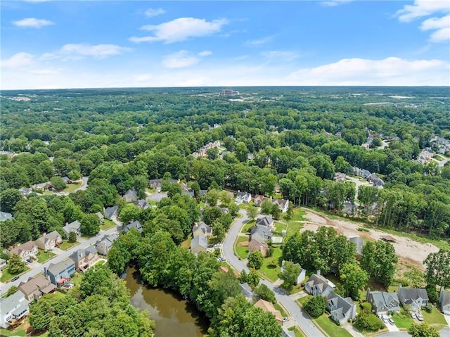 drone / aerial view featuring a water view and a residential view