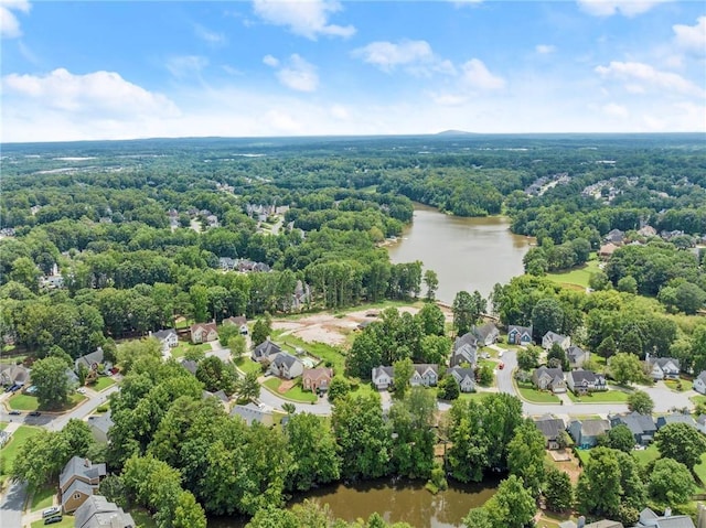 birds eye view of property with a water view, a forest view, and a residential view