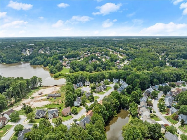 bird's eye view featuring a water view, a residential view, and a view of trees