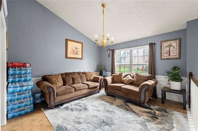 living room with vaulted ceiling and a notable chandelier